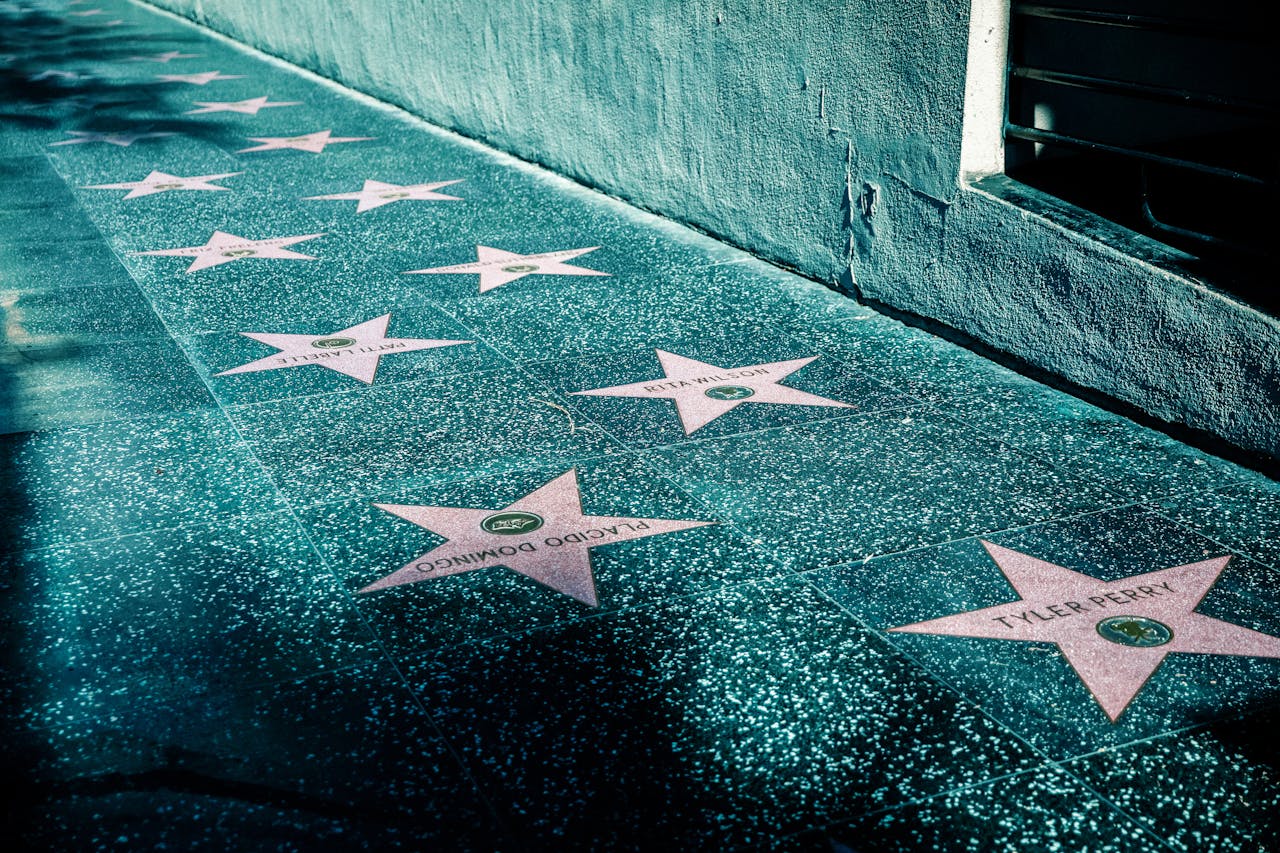 Pink Stars on Gray Tiled Street Sidewalk